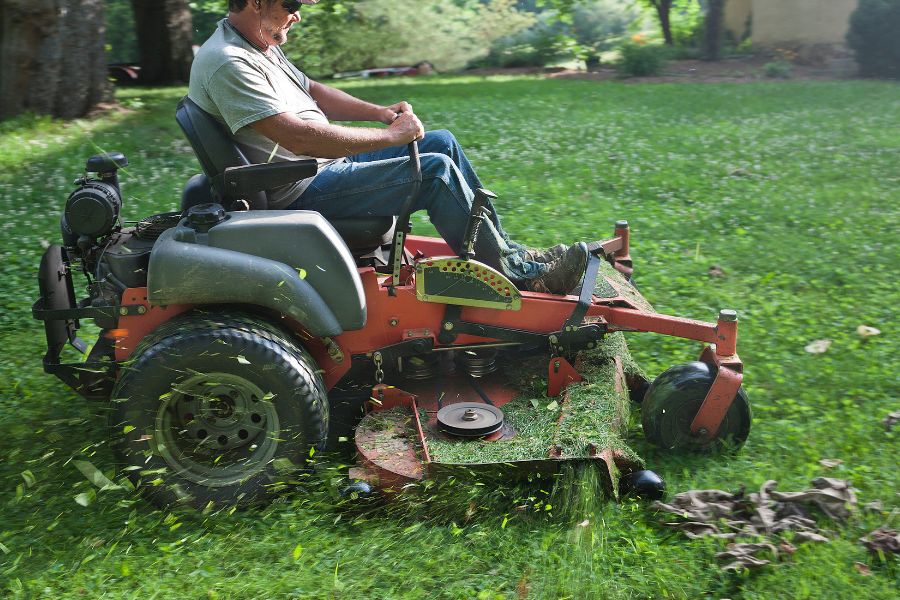 Man riding a riding mower